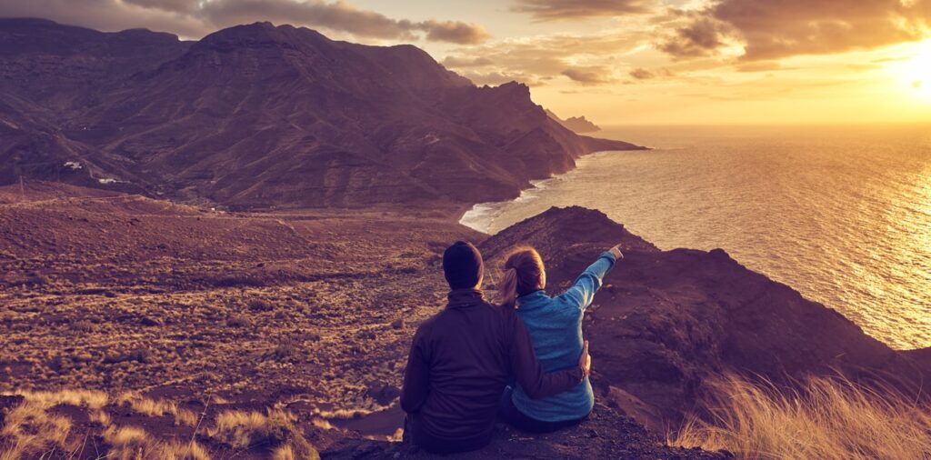 sunset couple Canary Islands cruises 2023