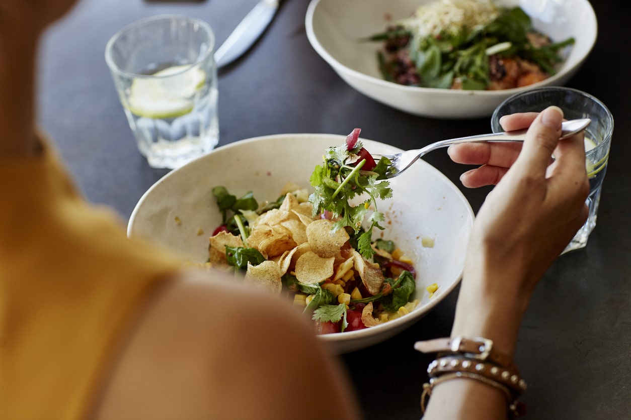 woman eating salad