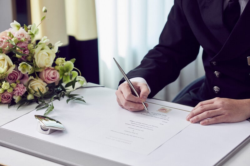 P&O cruises ceremonies at sea cruise wedding man signing register