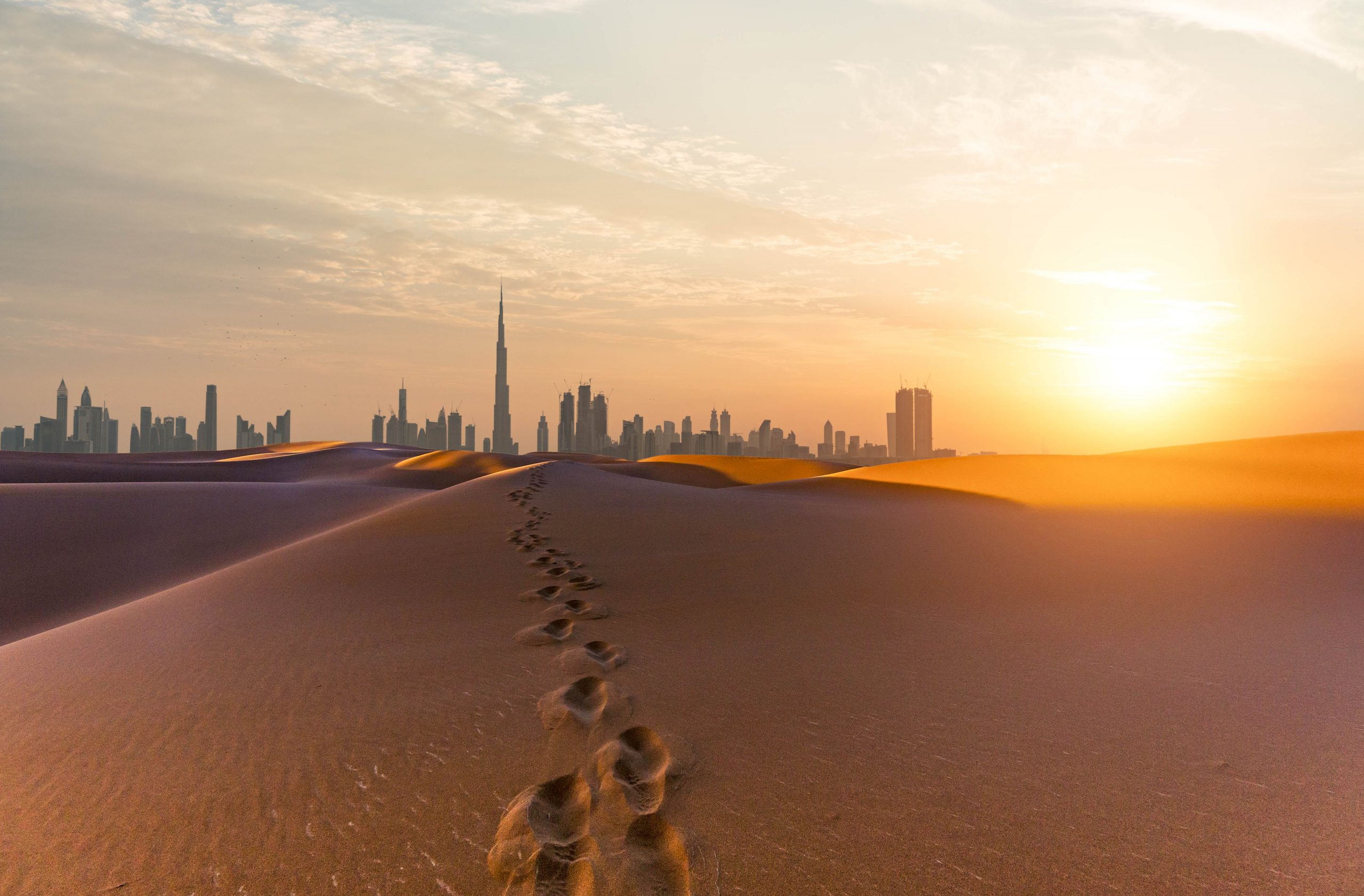 Tracks in the sand lead to Dubai's Burj Khalifa