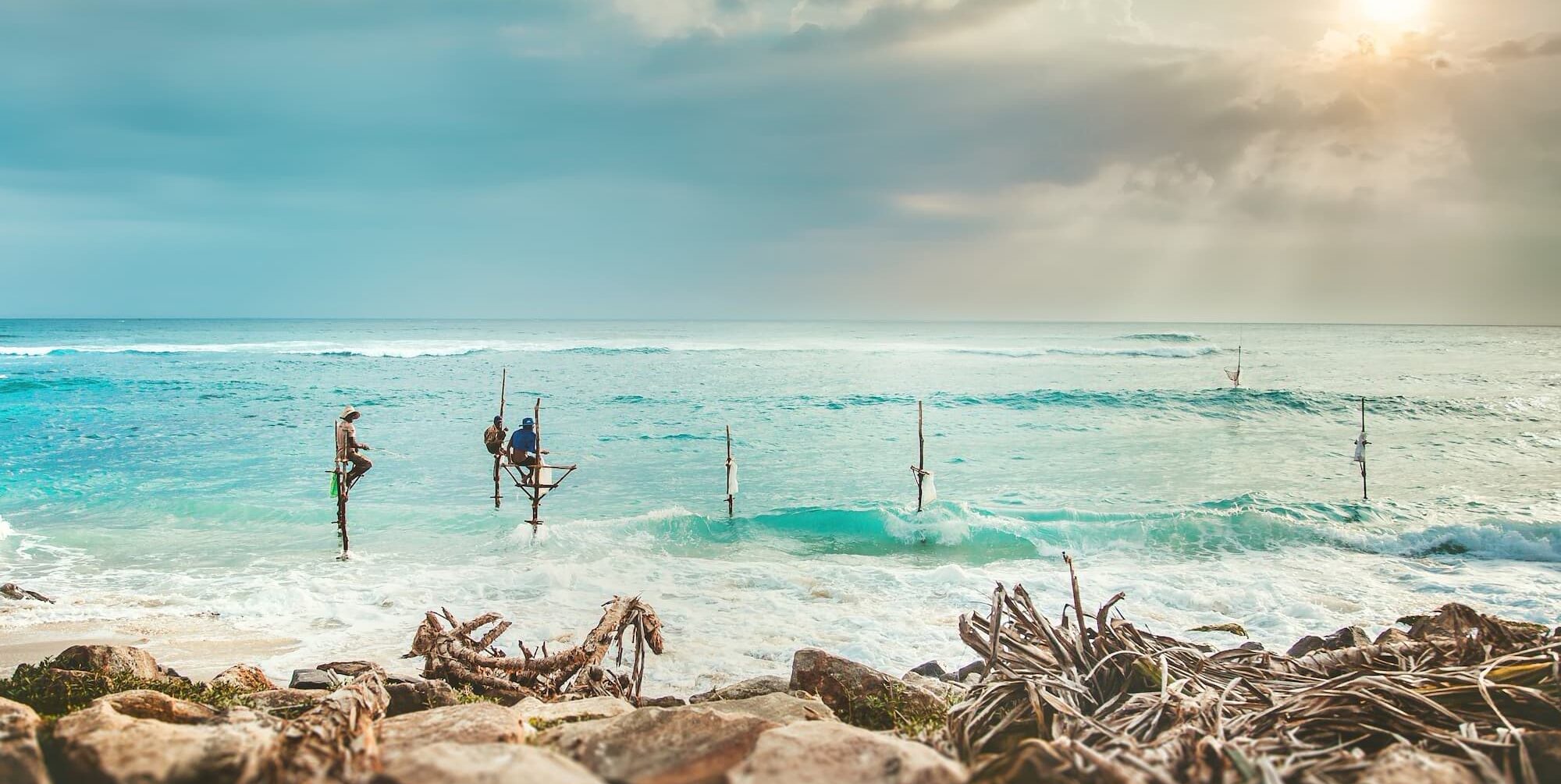 Fisherman on stilts in the sea in Sri Lanka