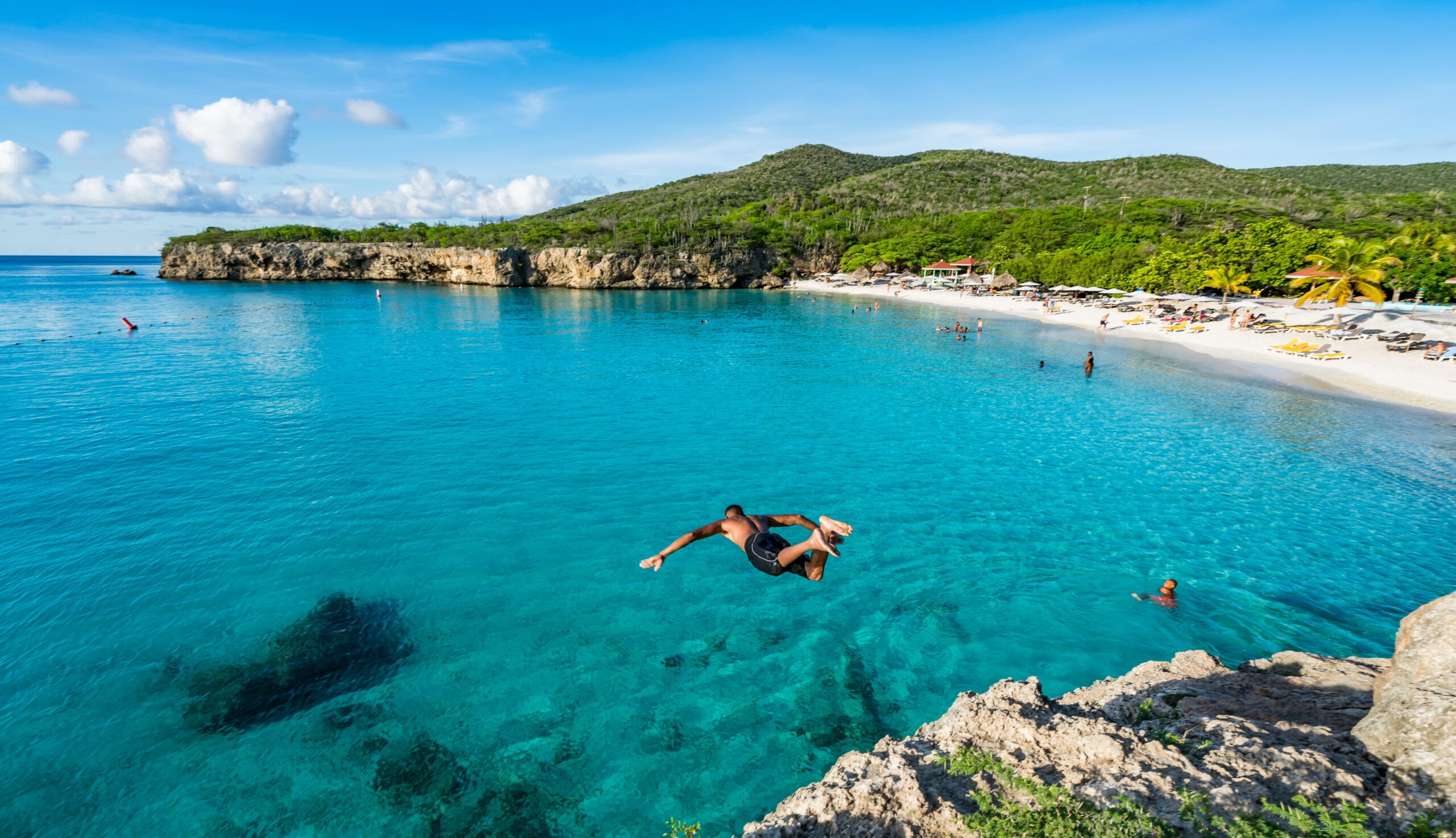 Caribbean man jumping into sea
