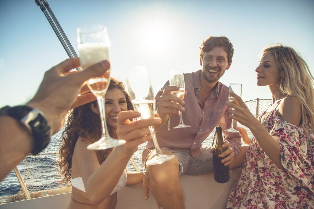 people drinking on a boat in the sun