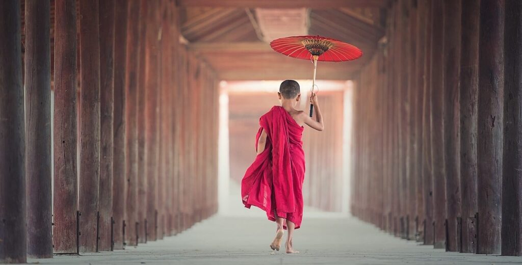 boy with umbrella buddhist temple january cruises