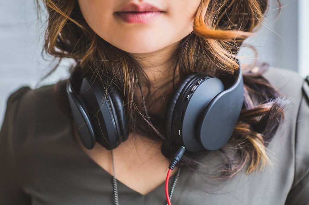 girl with headphones audible book club